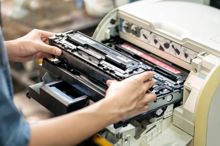btoners_printer Maintenance and Repair_women-holding-laser-toner-cartridge-replacing-toner-in_7135616-min-btoners.co.za